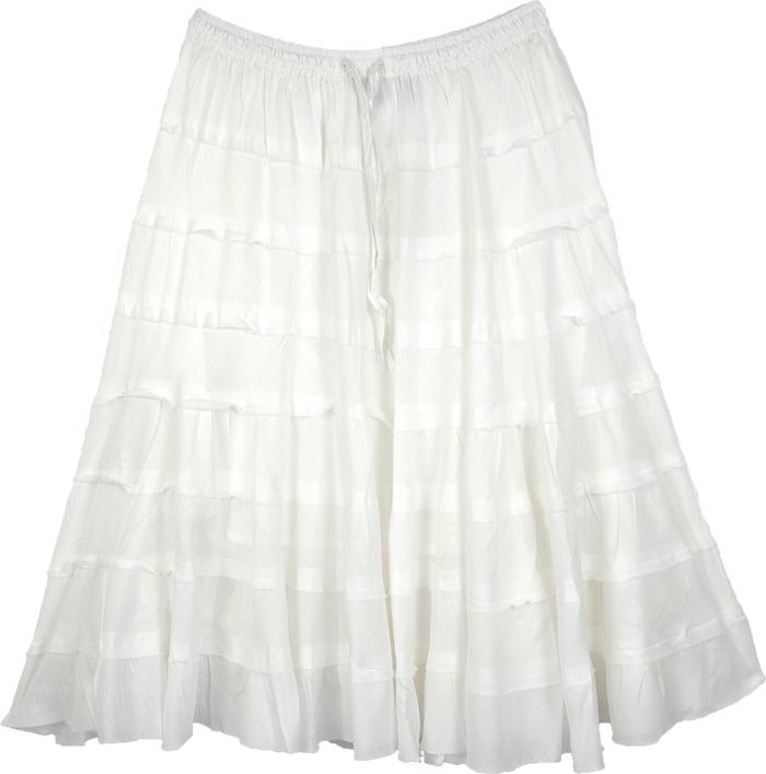 A solid white cotton skirt for summers with tiers in unfinished hem and a flouncy hemline. This short skirt is made from soft and comfortable cotton fabric and makes an ideal outfit for hot and humid weather. #tlb #JuniorPetite #TieredSkirt #vacationclothing #beachwrap #Solid #solidwhiteskirt #longcottonskirt #tieredbohoskirt Cotton Flowy Skirt With Layered Hem, Flowy Cotton Skirt With Layered Hem, Cotton Skirt With Layered Hem, White Flowy Skirt With Ruffle Hem, Flowy White Skirt With Ruffle Hem, White Flared Skirt With Ruffle Hem, Cotton Tiered Skirt With Layered Hem, Flowy Tiered White Skirt, White Flowy Skirt With Layered Hem