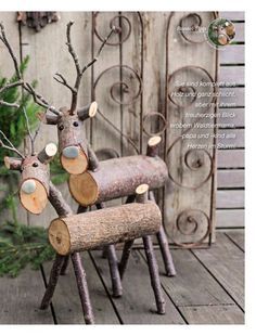 three wooden reindeer chairs sitting next to each other on a wood floor near a fence