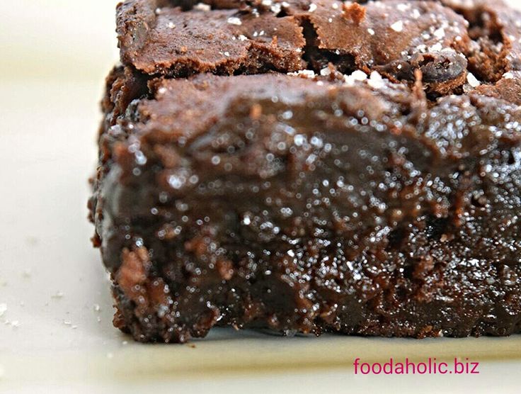 a close up of some brownies on a plate