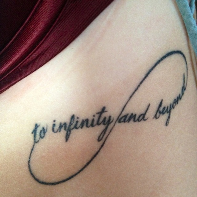 a tattoo with the words to infinity and beyond