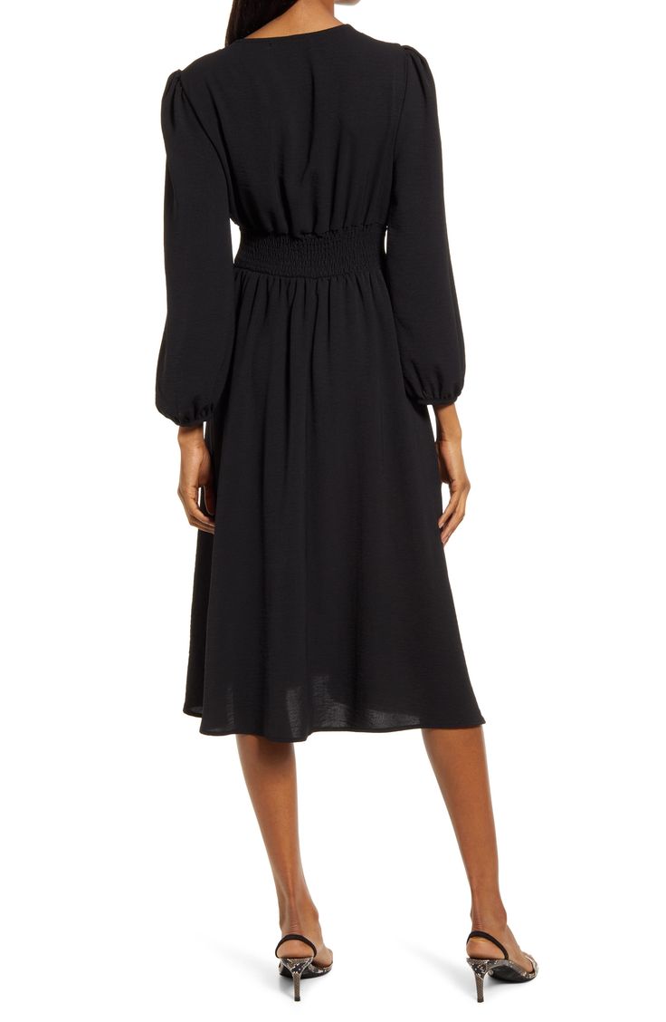 Move gracefully from day to night in this plunge-neck dress styled with puff sleeves and a drapey A-line skirt. 100% polyester Hand wash, line dry Made in the USA of imported fabric Fall V-neck Ruched Midi Dress, Chic Knee-length V-neck Dress With Gathered Sleeves, Solid V-neck Midi Dress With Smocked Back, Elegant V-neck Midi Dress With Elastic Sleeves, Evening Midi Dress With Blouson Sleeves For Fall, Fall Evening Midi Dress With Blouson Sleeves, Black V-neck Puff Sleeve Dress With Gathered Sleeves, Elegant V-neck Midi Dress With Elastic Waistband, Elegant Dress With Smocked Back And Bishop Sleeves