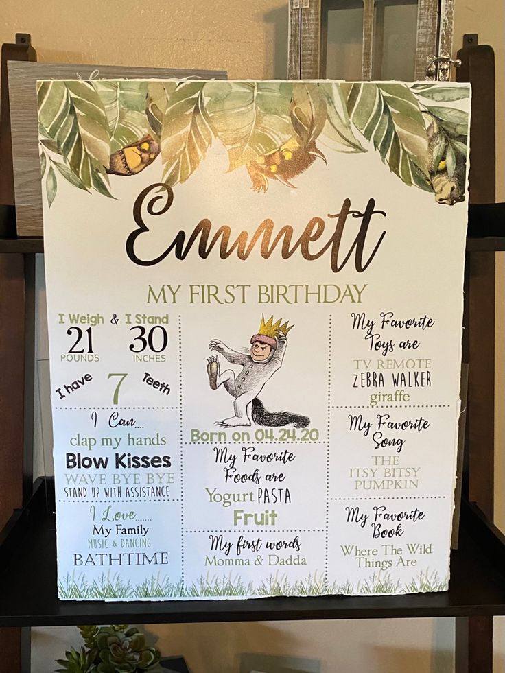 a sign that says emmett's first birthday with the date and time on it