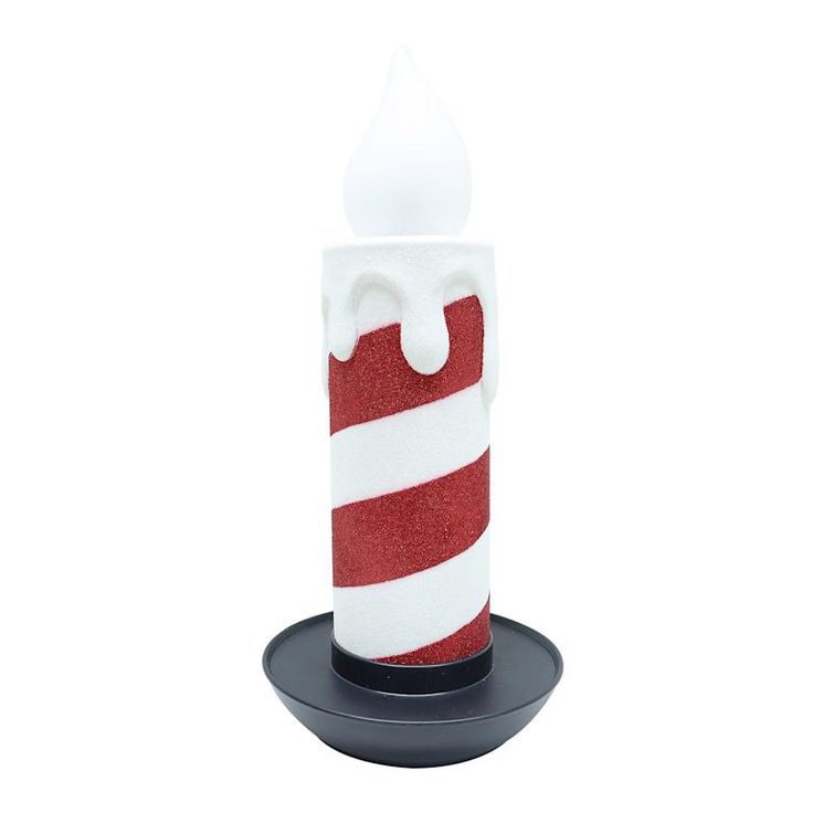 a red and white striped candle holder on a black stand with a white frosted top