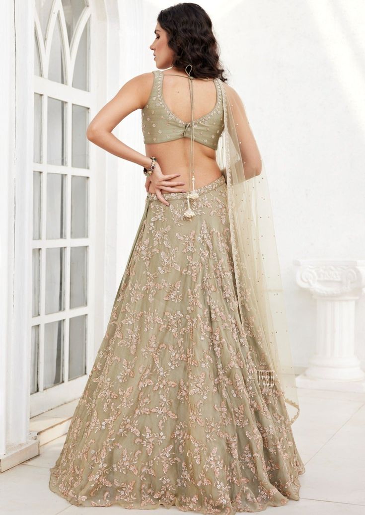 Dusty green intricate floral embroidered organza lehenga with an embroidered blouse paired with tulle dupatta having badla, glass beads and pearl work. Green Organza Lehenga, Mehendi Look, Badla Work, Organza Lehenga, Pearl Work, Green Lehenga, Vacuum Storage, Lehenga Skirt, Dusty Green