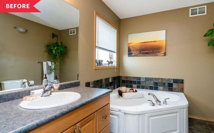 a bathroom with two sinks and a large bathtub