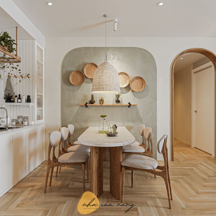 a dining room with white walls and wooden flooring has a round table surrounded by beige upholstered chairs