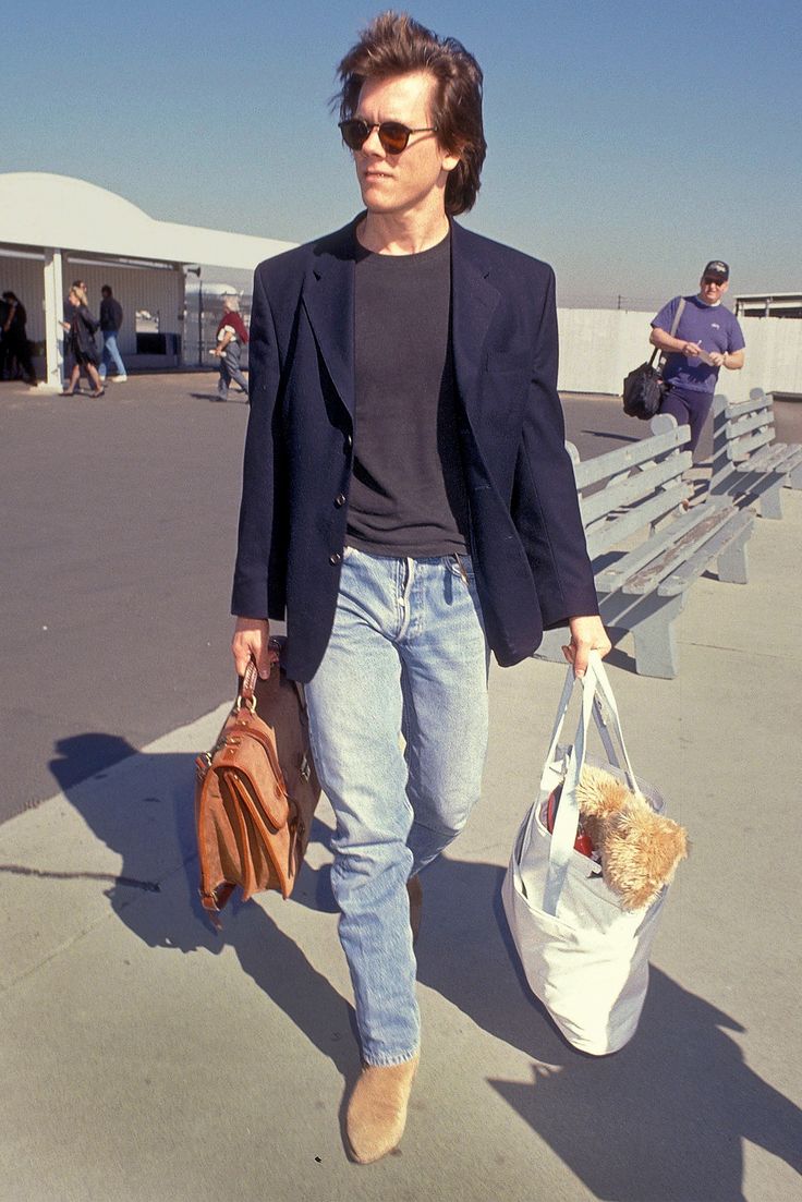 Fly Like Nic Cage: The Incredible Timeliness of '90s Airport Style | GQ Airport Fits, 90s Men, Kevin Bacon, Levis 501, Business Attire, Airport Style, Mode Inspiration, Halle, Look Cool