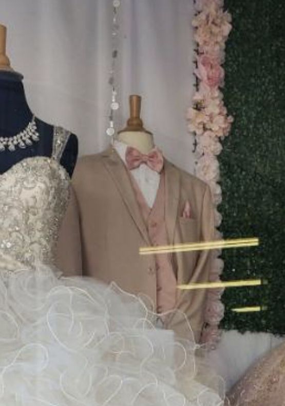 two mannequins dressed in wedding dresses and tuxedos