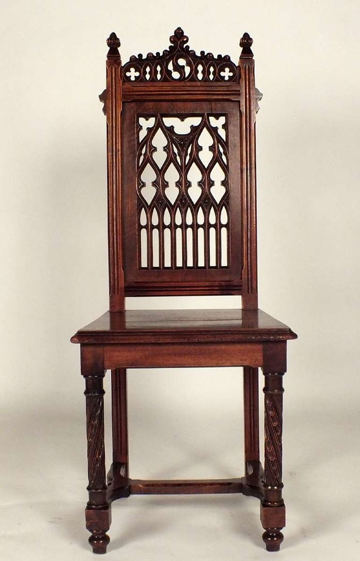 an old wooden chair sitting on top of a white floor