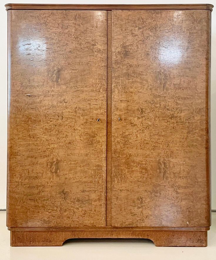 an old wooden cabinet with two doors