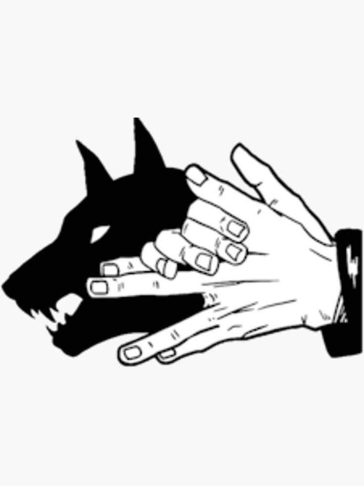 two hands touching each other over a dog's head