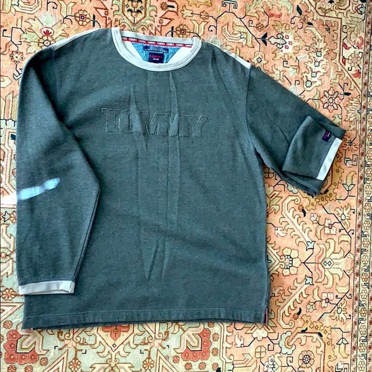 Tommy Hilfiger Sweatshirt. Stunning Charcoal Grey. Jump On The Casual Sweatshirt Trend But Still Look Like A Million Bucks. New Without Tags. Tommy Hilfiger Green Cotton Tops, Casual Cotton Tops With 3/4 Sleeves, Casual Cotton Top With 3/4 Sleeves, Casual Green Tommy Hilfiger Tops, Tommy Hilfiger Cotton Crew Neck Sweater, Casual Tommy Hilfiger Cotton Sweater, Tommy Hilfiger Sporty Top With Ribbed Cuffs, Sporty Cotton T-shirt With 3/4 Sleeve, Casual Cotton Sweater With 3/4 Sleeves