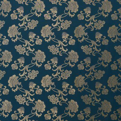 a blue and gold wallpaper with flowers on it