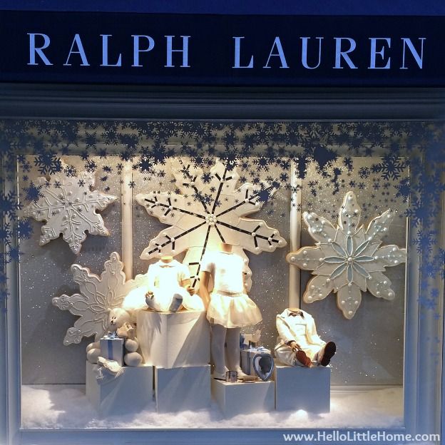 a window display with snowflakes and lights