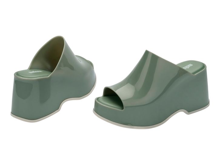 Throwback style meets current trends—that’s just how the Patty rolls. Lightweight and streamlined with a wide strap and a peep toe, these platform mules are true attention seekers, and the contrasting sole detail amps up the cool factor. Made from our revolutionary Melflex® PVC plastic, you enjoy more flexibility and comfort. Plus, they’re 100% recyclable. Trendy Platform Slip-on Slides, Modern Platform Slip-on Slides, Casual Open Heel Platform Slippers For Spring, Casual Spring Platform Slippers With Open Heel, Chic Platform Slide Slippers, Trendy Platform Wedge Slides, Trendy Wedge Heel Platform Slides, Trendy Platform Slides With Wedge Heel, Modern Round Toe Platform Slippers For Spring