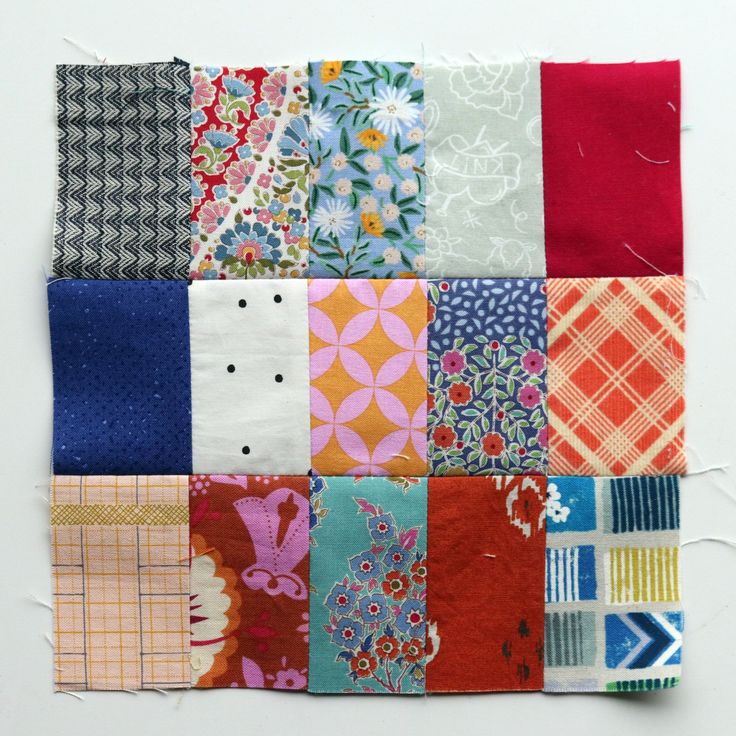 a patchwork quilt with different colors and patterns