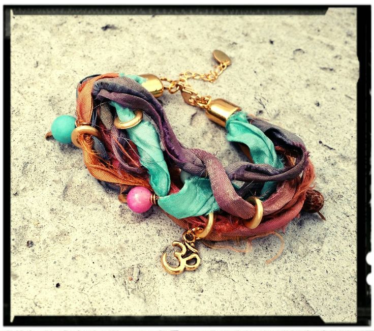 "Bohemian Wrap Bracelet in a Colorful Sari Silk Mix. Gold Rings, Natural Stone Beads and a Golden Om Charm. Lobster Clasp with 2\" Extension Chain allows for a perfect fit for any wrist size. You may leave your wrist measurement if you prefer. *Custom Orders Welcome* Gift Box, Extras, etc... May be purchased in the Ala Carte Listing. https://www.etsy.com/listing/286913011/ala-carte-ordersadd-onsextras-stainless" Handmade Bohemian Bracelets For Festival, Green Bohemian Wrap Bracelet For Festival, Silk Ribbon Jewelry, Sari Silk Jewelry, Silk Wrap Bracelets, Beaded Boho Necklace, Bohemian Wrap, Jewelry Making Classes, Om Charm