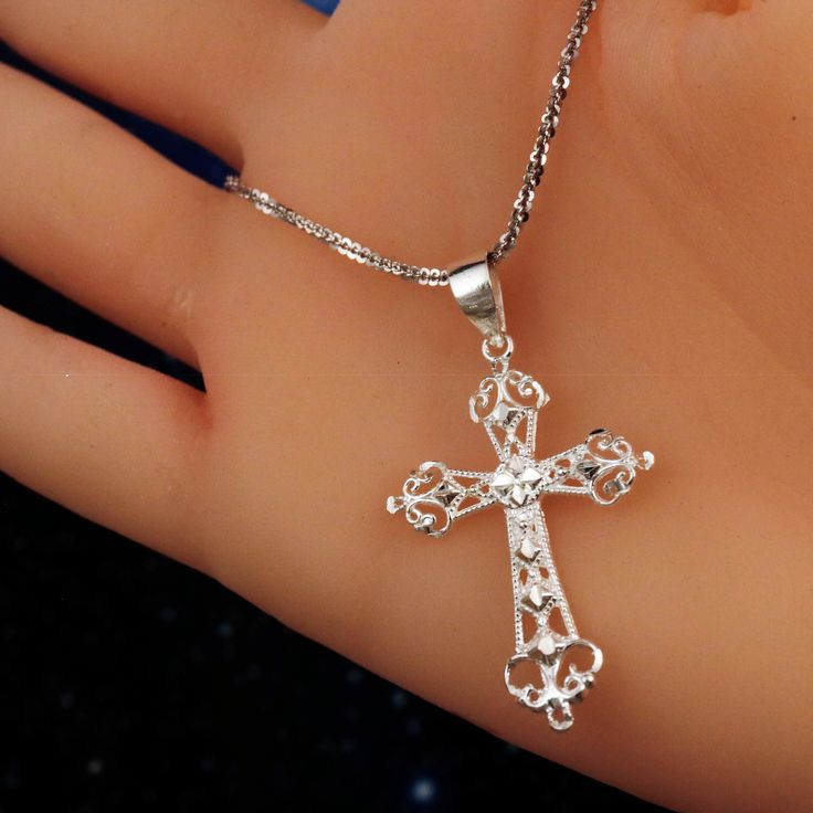 "Keep scrolling down for additional information! This listing contains multiple photos and a detailed description with dimensions Have questions? please ask. Real 925 Sterling Silver high polished Diamond cut Cross pendant with cut out details Product Type: Sterling Silver Pendant Product Dimension: Pendant height 1 3/4\" (including bail) Product Dimension: Pendant width 1\" Product Fastening: Sterling Silver Bail Product Materials: Sterling Silver Product Hallmark: 925 stamped on the back of th Pierced Cross Pendant Jewelry Gift, Pierced Crucifix Jewelry Gift, Filigree Crucifix Necklace For Gift, Crucifix Filigree Necklace For Gift, Ornate Sterling Silver Cross Jewelry, Crucifix Necklace With Intricate Design For Gifts, Intricate Crucifix Necklace For Gift, Intricate Crucifix Necklace As A Gift, Silver Cross Jewelry With Intricate Design