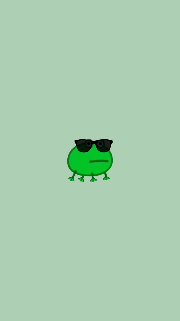 a green frog with sunglasses on its face