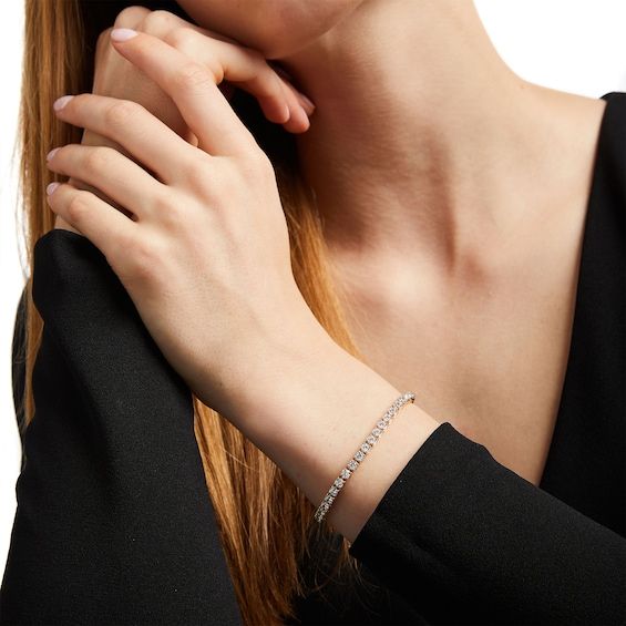 Dare to dazzle when you wear this 7 ct. t.w. diamond tennis bracelet in 14K gold, a timeless style that complements any occasion or style. Crafted in 14K gold Sparkling 1/8 ct. diamonds line this continuous design. Stunning with 7 cts. t.w. of diamonds This 7.25-inch bracelet secures with a tongue and groove clasp. Classic Baguette Cut Tennis Bracelet, Timeless Diamond White Tennis Bracelet With Baguette Cut, Timeless White Gold Tennis Bracelet With Baguette Cut, Timeless Tennis Bracelet With 17 Jewels, Timeless White Gold Baguette Cut Tennis Bracelet, Fine Jewelry Baguette Cut Diamond Bracelet, Classic Diamond Bracelet With 17 Jewels, Timeless Tennis Bracelet With Diamond Accents And Baguette Cut, Timeless Diamond Bracelet With Baguette Cut Accents