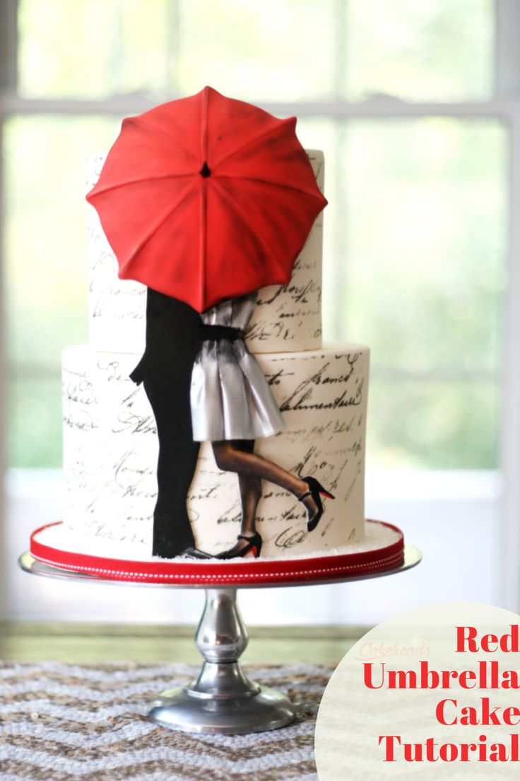 a wedding cake with an umbrella on top