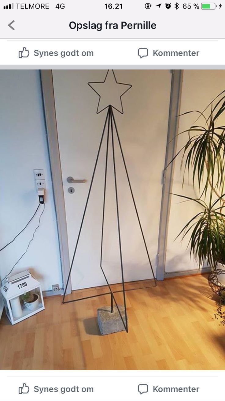 an image of a room with a plant on the floor and a phone hooked up to it