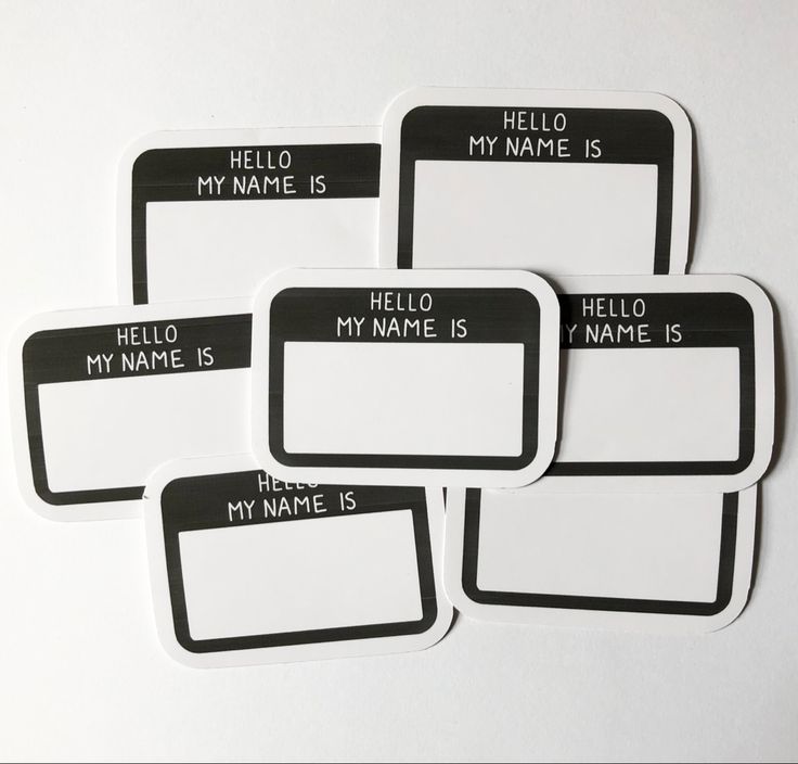 four black and white name tags with the words hello my name is