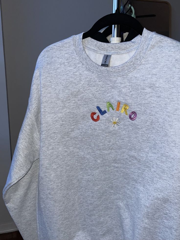 clairo hoodie grey crewneck find on etsy juicecodesigns Grey Embroidered Sweatshirt, Crewneck Design, Grey Crewneck, Clothing Ideas, Grey Hoodie, Heather Grey, Sweat Shirt, Gender Neutral, Bathing Beauties