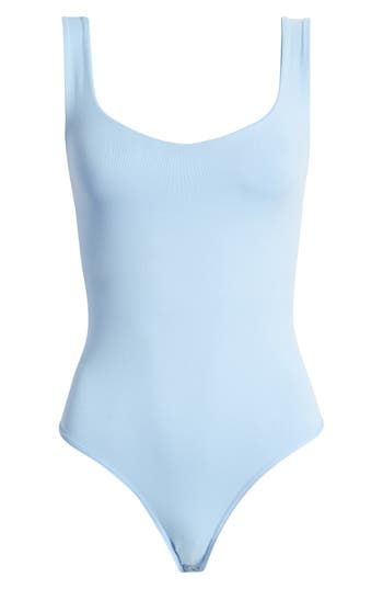 Love to layer in this shapely tank bodysuit designed with a perfectly scooped neckline. Scoop neck Sleeveless 92% nylon, 8% elastane Machine wash, dry flat Made in the USA Summer Nylon Leotard With Smoothing Details, Smoothing Nylon Leotard For Summer, Chic Summer Bodysuit With Scoop Back, Chic Seamless Summer Leotard, Summer Second-skin Leotard With Scoop Back, Summer Leotard With Scoop Back And Second-skin Fit, Second-skin Scoop Back Leotard For Summer, Summer Bodysuit With Minimal Stretch And Scoop Back, Fitted Nylon Tank Top With Scoop Neck