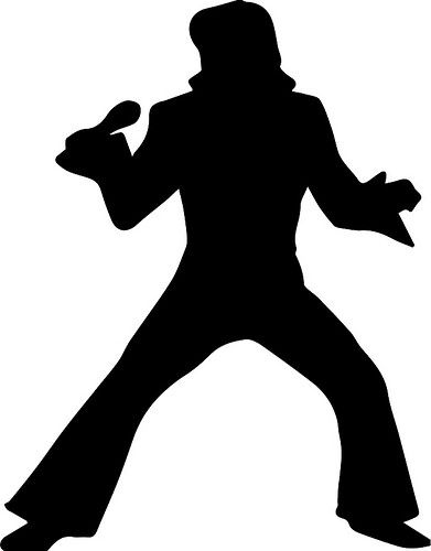 the silhouette of a man in a hat and long pants is holding a baseball bat