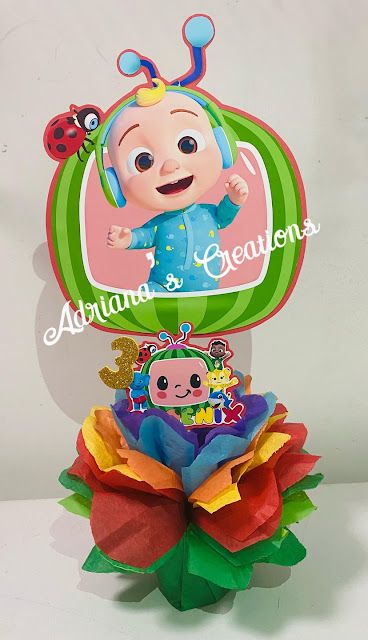 a baby's first birthday card on top of a flower with a ladybug in the center