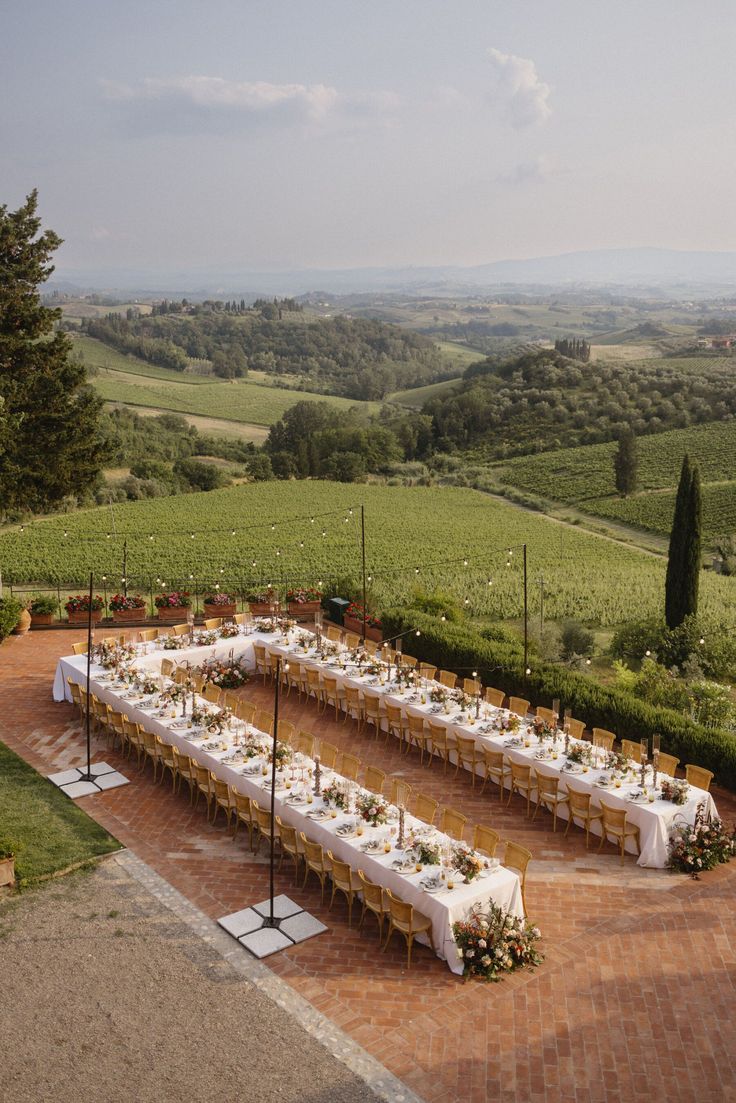 a long table set up in the middle of a field