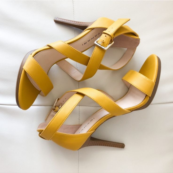 Luxury Women’s Designer Shoes “Tahari” Luxe Mustard Heel Sandal “Tahari” Luxe Mustard/Muted-Yellow Heel Sandals! Versatile Day To Night Wear! Pairs Well With Most Styles! Wears Well For Most Occasions! Easy Elevation To Any Style! Next Level Footwear! Simple Sophistication! Luxe Designer Heel Sandal Simple Sexy Multi Strapped Instantly Elevates Any Style Side Bucket Closure Versatile Day To Night Wear 4” Heel Height Pairs Well W/Most Styles Next Level Status Footwear Excellent New Condition Smoke Free Pet Free Environment Thanks For Browsing My Boutique!! Yellow Open Heel Shoes With Heel Loop, Yellow Sandals With Heel And Ankle Strap, Yellow Open Toe Sandals With Heel Strap, Yellow Open Toe Heels With 4-inch Heel, Yellow Sandals For Formal Spring Events, Yellow Formal Sandals For Spring, Yellow Sandals With 4-inch Heel For Spring, Yellow High Heel Sandals With Heel Strap, Yellow Sandals With 4-inch Heel For Party