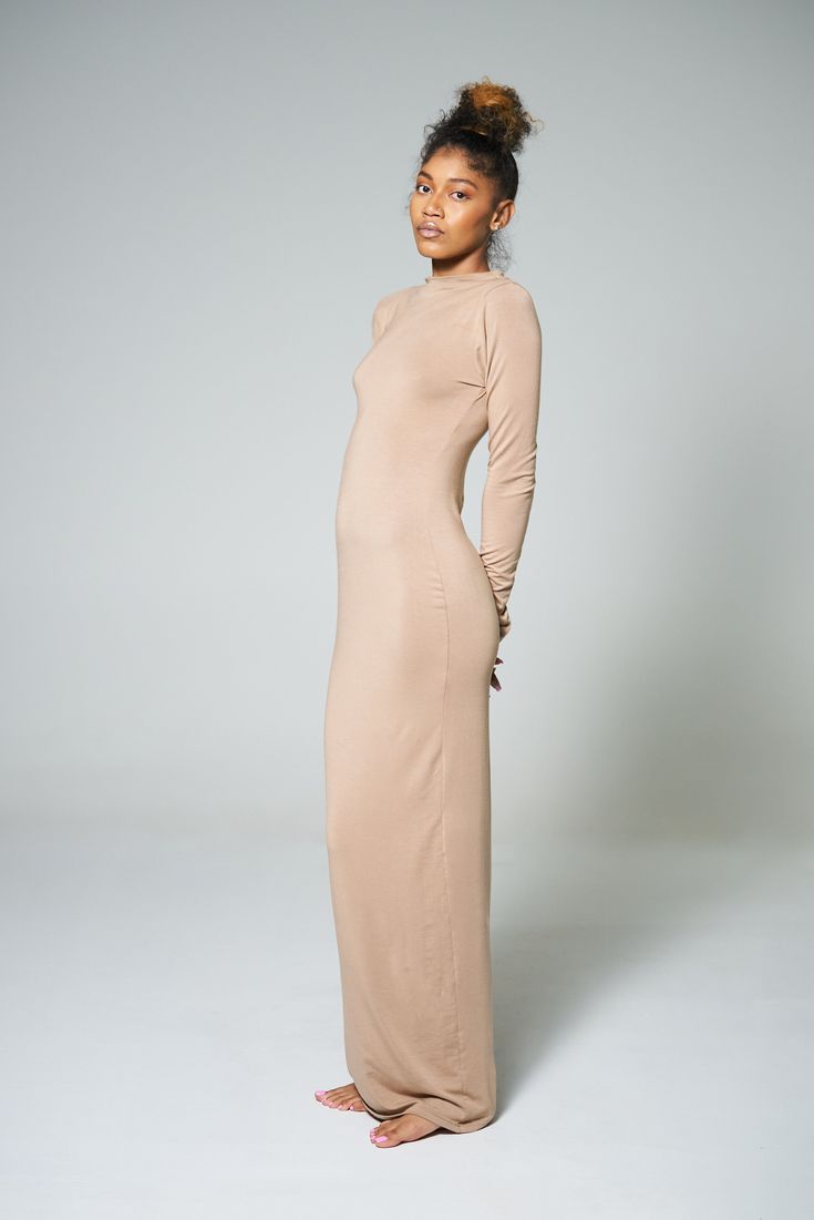 The Naomi dress features a sleek ankle-length silhouette and long sleeves for a timeless and elegant look. Its sleek design and comfortable fabric provide a flattering fit, perfect for any occasion. FABRIC• Jersey Modal Elegant Long Sleeve Maxi Dress With Side Slits, Sleek Long Sleeve Formal Maxi Dress, Spring Sleek Floor-length Maxi Dress, Sleek Floor-length Maxi Dress For Spring, Sleek Spring Floor-length Maxi Dress, Long Sleeve Fitted Maxi Dress With Side Slits, Elegant Full Length Long Sleeve Dress For Spring, Fitted Maxi Dress With Side Slits For Work, Sleek Fitted Long Sleeve Midi Dress