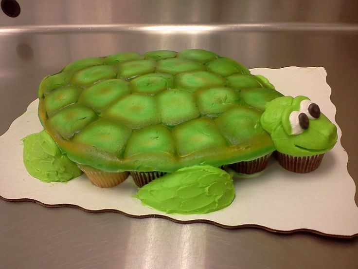 a cupcake shaped like a turtle sitting on top of a table