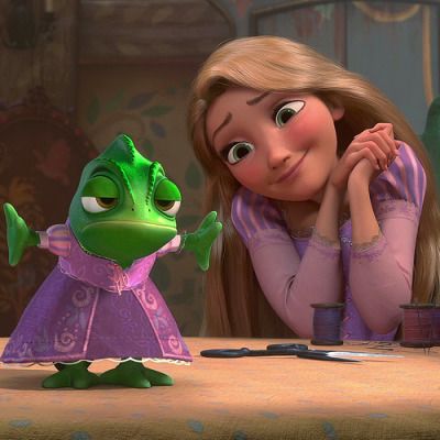 the princess and the frog are sitting at a table