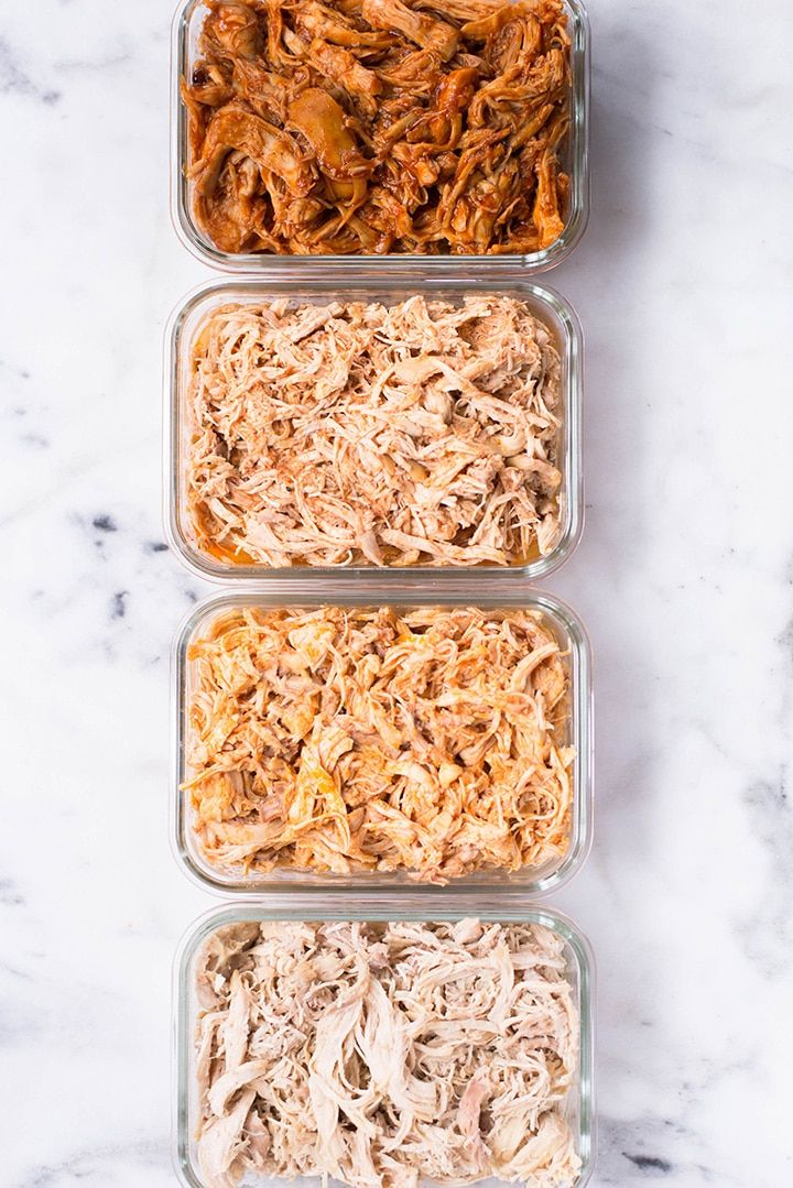 three glass containers filled with pulled pork and shredded carrots on top of a marble counter