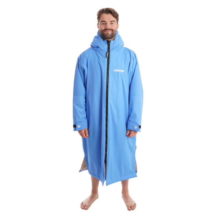 The Electric Blue Long Sleeve Changing Robe from Coucon is designed for optimal protection and warmth while allowing easy changing. Ideal for those who want to stay the warmest and spend long periods of time outdoors. The Coucon is a premium changing robe designed to offer optimal protection from the elements in any location. Featuring a fully waterproof windproof breathable shell and our luxury lining that has unparalleled warmth and softness, you can change anywhere anytime in comfort without Blue Windproof Outerwear For Outdoor Activities, Blue Weatherproof Outerwear For Outdoor Activities, Weatherproof Blue Outerwear For Outdoor Activities, Blue Weatherproof Sports Outerwear, Blue Outerwear With Fleece Lining For Outdoor Activities, Blue Windproof Outerwear For Winter Sports, Blue Insulated Hooded Outerwear, Blue Insulated Outerwear For Cold Weather, Insulated Blue Outerwear For Outdoor Activities