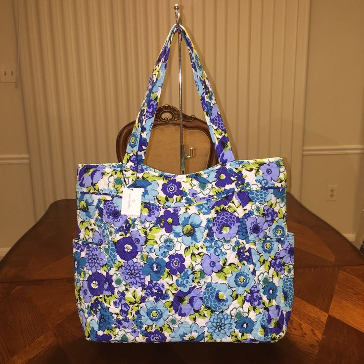 100% Authentic And Brand New With Tag. Price Firm Stock Photos Pattern Placement Might Be Different. Dimensions 14 ¾" W X 14" H X 5 ¼" D With 10 ½" Strap Drop Casual Blue Floral Print Shoulder Bag, Casual Blue Shoulder Bag With Floral Print, Blue Shoulder Bag With Pockets For Spring, Everyday Blue Floral Print Shoulder Bag, Blue Floral Print Shoulder Bag For Everyday, Blue Floral Print Shoulder Bag For Spring, Blue Floral Print Shoulder Bag For Travel, Blue Floral Print Travel Bag, Blue Floral Print Shopping Bags