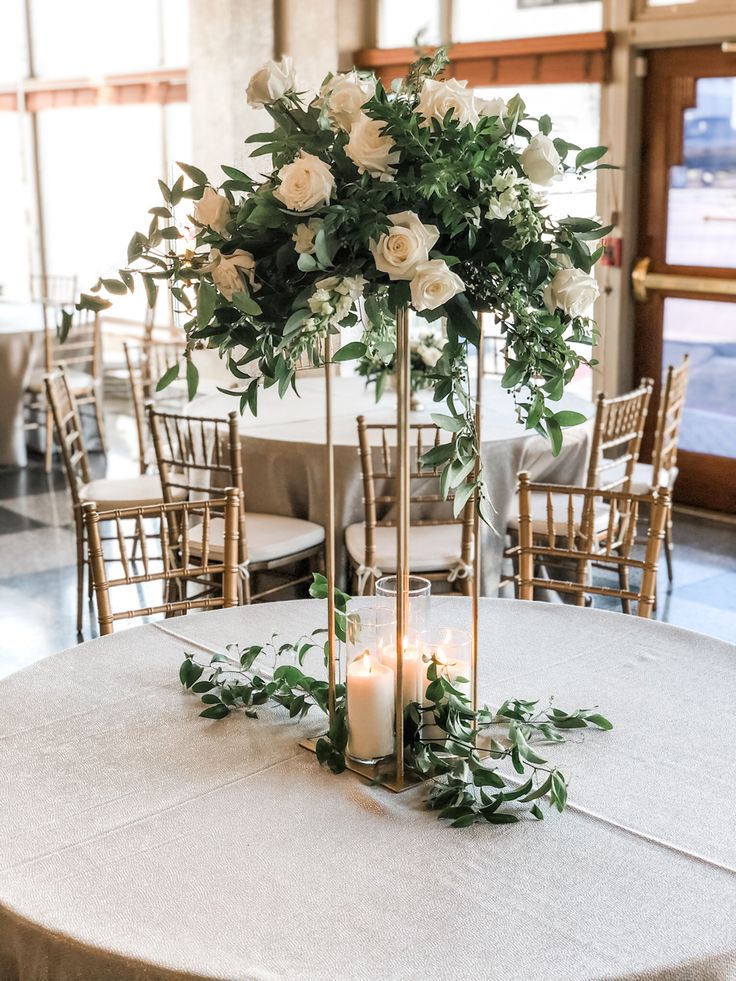 a table with candles and flowers on it