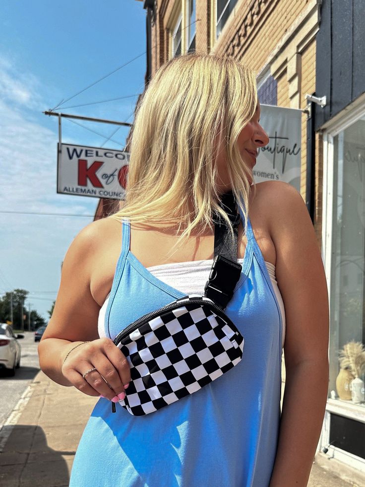 Forget the backpack and get your hands on the fanny. This super-chic, waterproof fanny pack is the quickest way to turn heads. With its water-resistant nylon construction, adjustable strap and quick side release buckle, this bag is ready for adventure. Checkered print fanny pack Waterproof Adjustable strap Quick side release buckle Round zipper closure Inner mesh side pockets Summer School Chest Bag With Adjustable Strap, School Belt Bag Backpack With Adjustable Strap, Casual Summer Belt Bag With Zipper Closure, Trendy Nylon Chest Bag, Trendy Chest Bag Backpack For Outdoor Activities, Trendy Nylon Chest Bag For Outdoor Activities, Summer Travel Belt Bag With Adjustable Strap, Trendy Backpack For Outdoor Activities With Adjustable Strap, Trendy Backpack With Adjustable Strap For Outdoor Activities