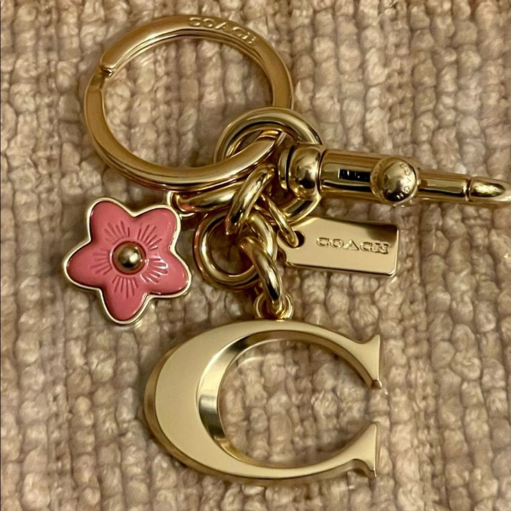 Nwt Coach Signature "C" Bag Charm Plated Brass & Resin Keychain/ Key Fob / Bag Charm. Brand New & 100% Authentic! Style: #. Color: Im / Gold Brass & Rose Resin And Metal Attached Split Key Ring And Dogleash Clip Cute Girly Keychains, Cute Small Keychains, Cute Keychains For Car Keys And Wallet, Coach Bag Charms, Keychain Aesthetic Car Keys, Coach Bag Charm, Cute Etsy Finds, Cute Car Keys Keychains Ideas, Key Ring Aesthetic