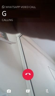 a cell phone with the text whatsapp video call calling circled by a red circle