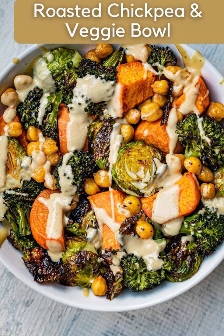 roasted chickpea and veggie bowl with ranch dressing in a white bowl