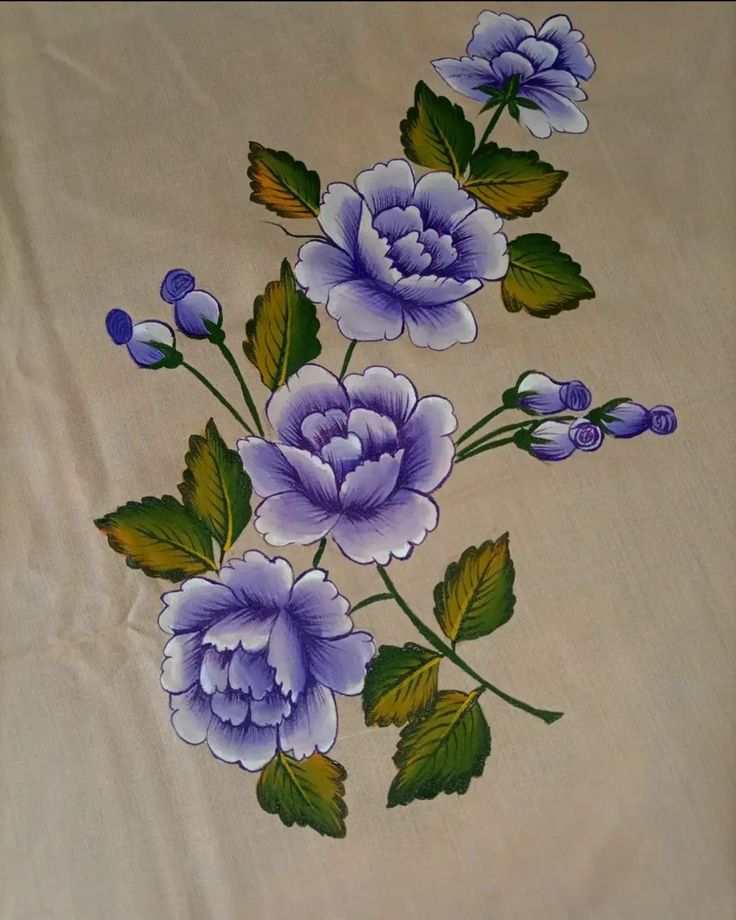 a white table cloth with blue flowers on it