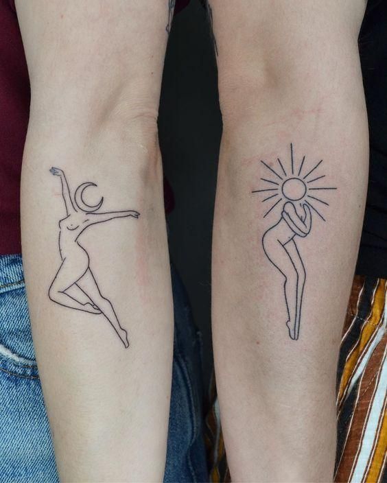 two people with matching tattoos on their arms