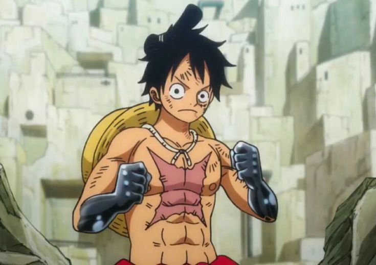 an anime character with no shirt on and gloves around his waist, standing in front of a stone wall