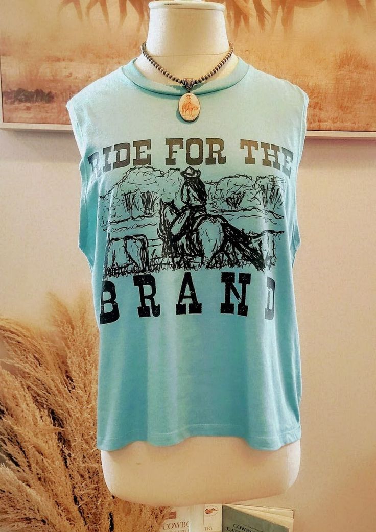 Simple, but fun tee. A cowgirl bringing in cattle to brand. Ride For The Brand. Super Soft Heather Stone Tee S-2xl Western Pre-shrunk Tops For Summer, Graphic Print Crew Neck Tops For Western-themed Events, Crew Neck Top With Graphic Print For Western-themed Events, Western-style Letter Print Tops For Western-themed Events, Western Style Summer Tops With Letter Print, Western-themed Graphic Print Cotton Tops, Cotton Graphic Print Top For Western-themed Events, Casual Cow Print Tops With Relaxed Fit, Western Crew Neck Tops With Letter Print