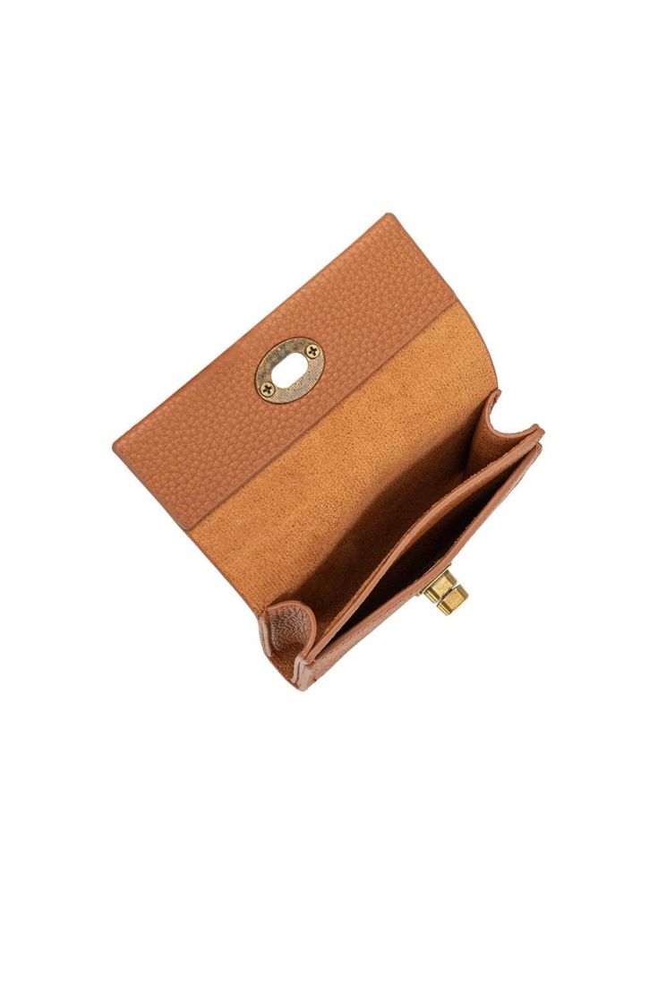 Crafted with a turn lock closure and made from vegan leather, the Rita card case is perfect for those looking for an elegant, sophisticated accessory. Designed with a pebbled finish and faux suede lining. Vegan Leather 4"W x 3.25"H x .75"D Turn-Lock Closure Brass-Tone Hardware Two Card Slots Faux Suede Lining Classic Gold Leather Coin Purse, Elegant Compact Trifold Wallet With Coin Pocket, Elegant Compact Trifold Wallet With Card Slots, Elegant Compact Trifold Wallet With Interior Card Slots, Elegant Cognac Wallet With Card Slots, Elegant Cognac Wallets With Card Slots, Elegant Compact Leather Trifold Wallet, Elegant Compact Trifold Wallet For Daily Use, Elegant Envelope Coin Purse With Interior Card Slots