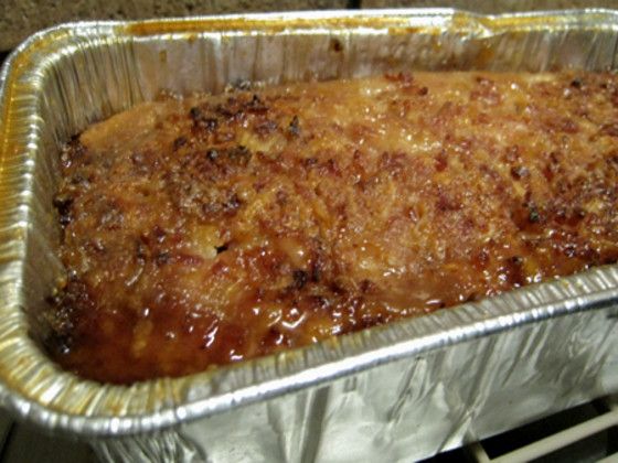 an uncooked casserole dish is sitting on the stove